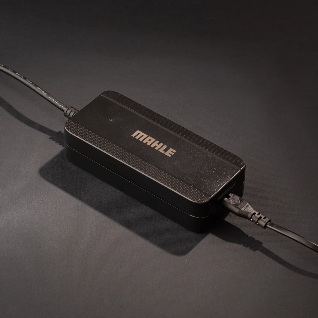 Compact charger with LED indicator for quick and efficient recharging at home or on the go.